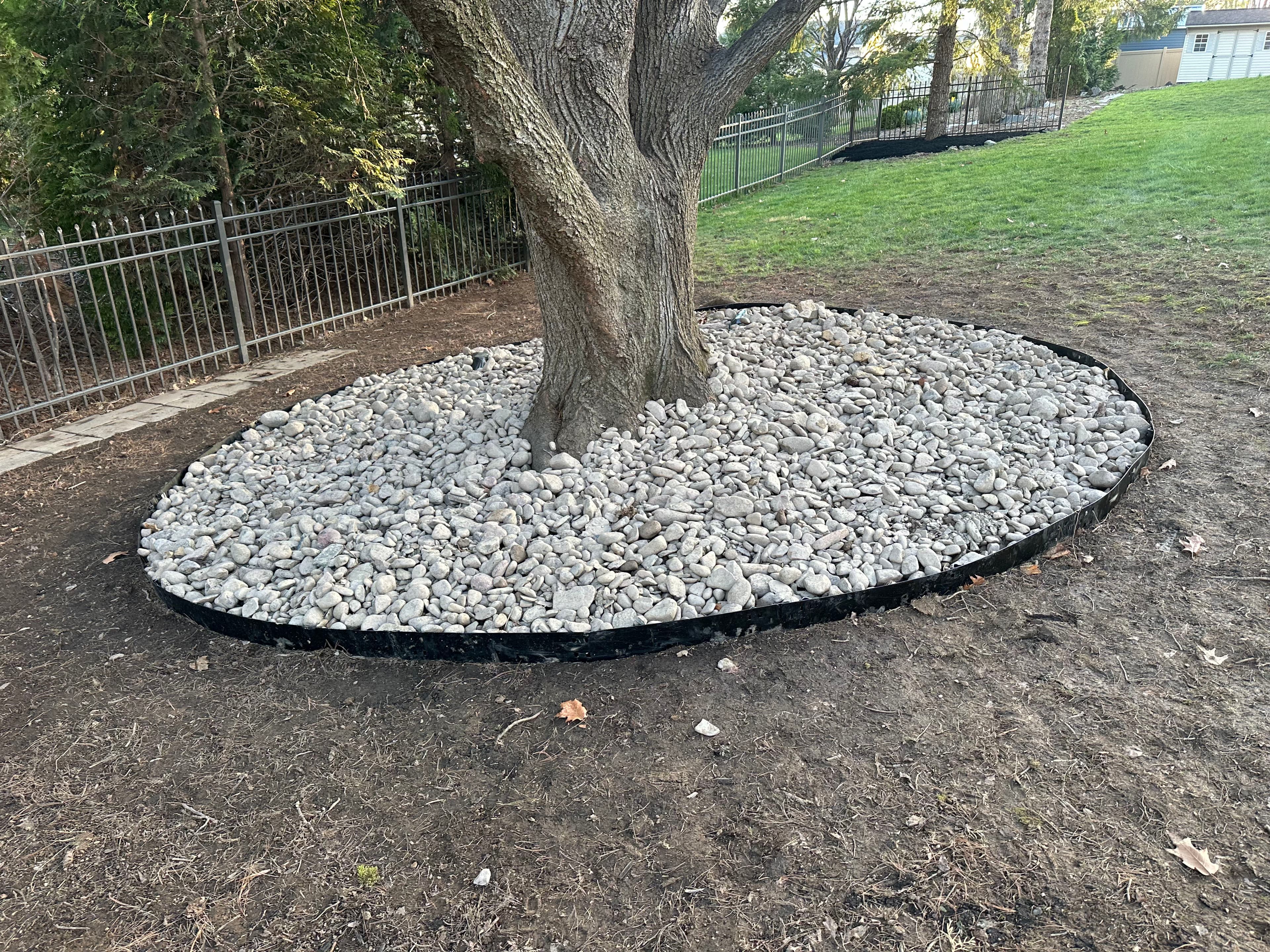 Project Boost Your Backyard Appeal with Black Mulch and River Rock image