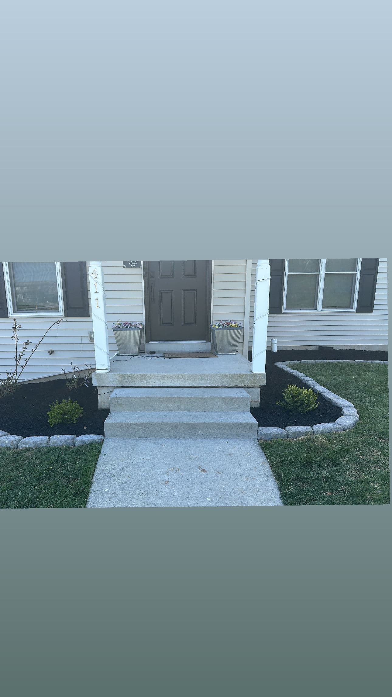 Front Yard Stone Bed Build with Paver Border and Black Mulch image