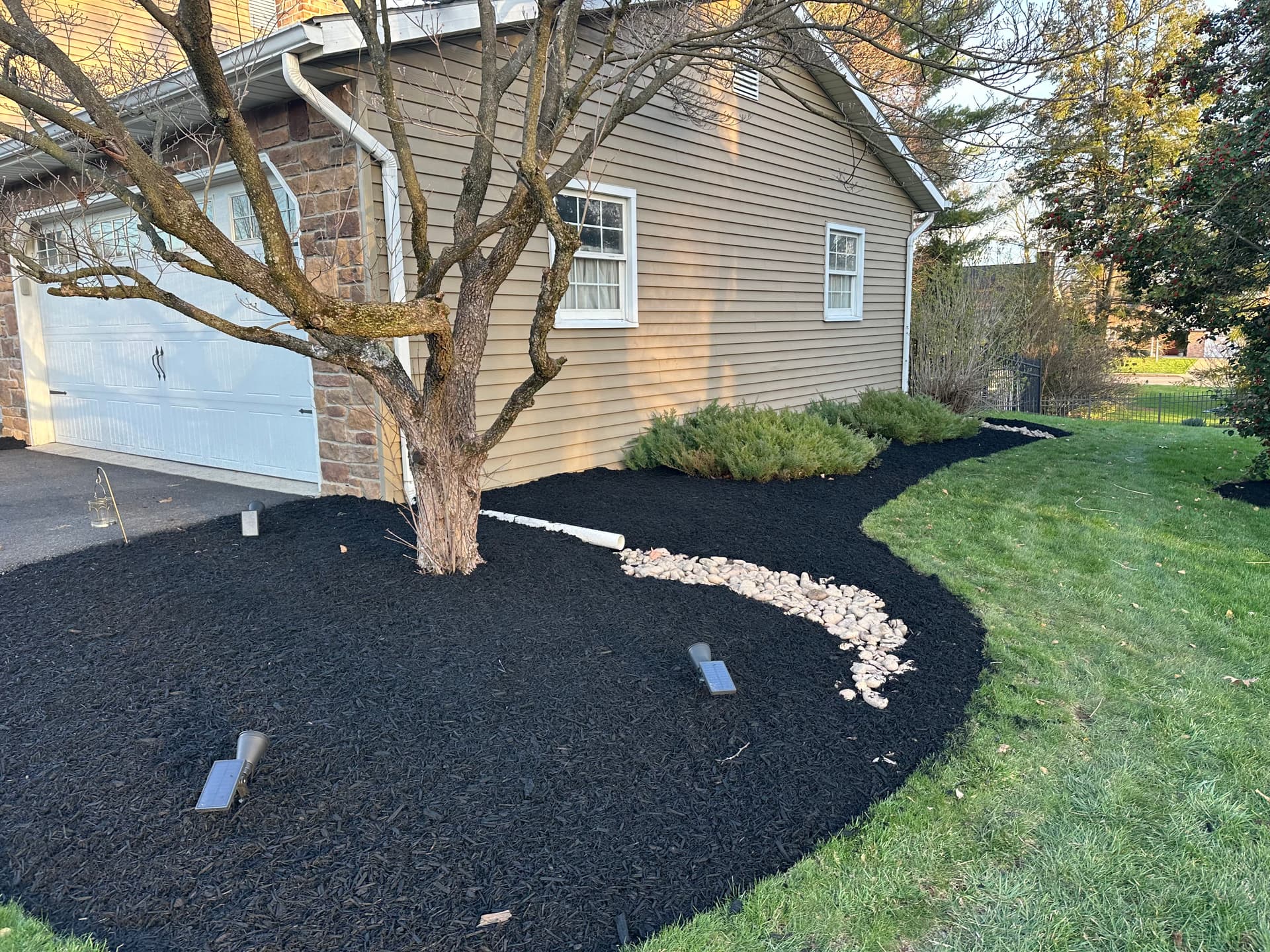 Gallery photos for Boost Your Backyard Appeal with Black Mulch and River Rock: Image #3