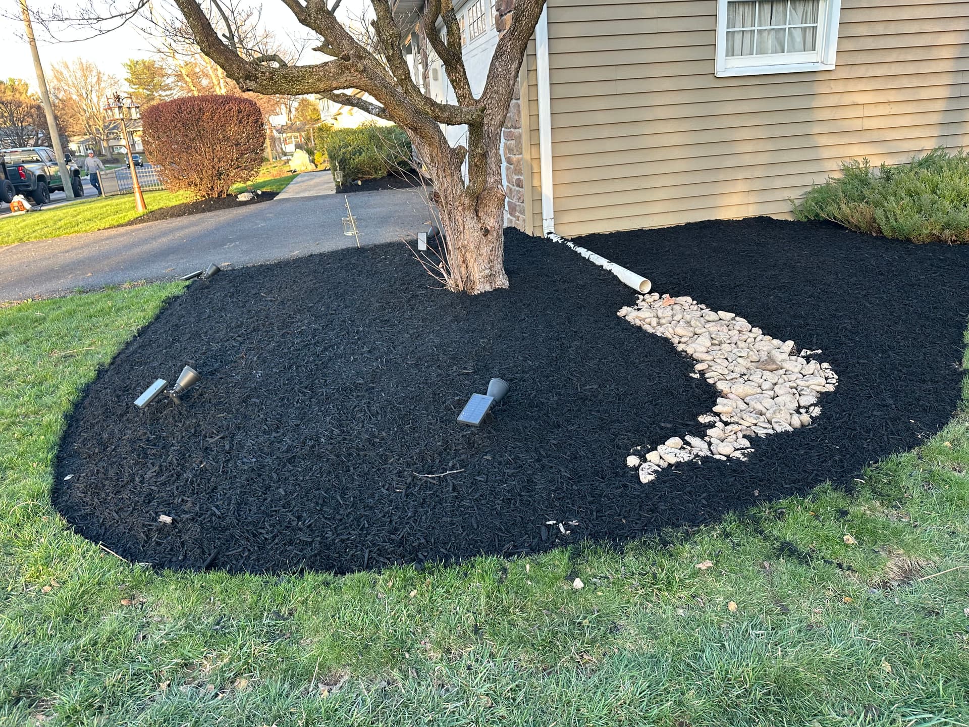 Gallery photos for Boost Your Backyard Appeal with Black Mulch and River Rock: Image #5